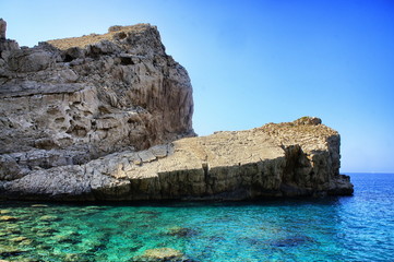 Coast of Ibiza, the sea and the rocks.