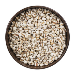 Job s Tears. Heap of organic brown rice in wooden bowl