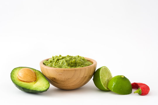 Nachos, guacamole and ingredients isolated on white background


