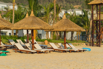 Sunbeds and umbrellas on the beach of Nha Trang, Vietnam