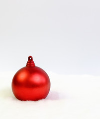 Red christmas ball on white background