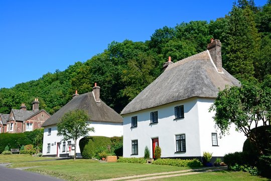 Thatched cottage and post office along the main village street, Milton Abbas.
