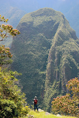 Fototapeta na wymiar Man stands on a rock. Peru