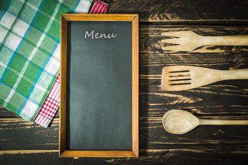 Wooden kitchen accessories and menu blackboard