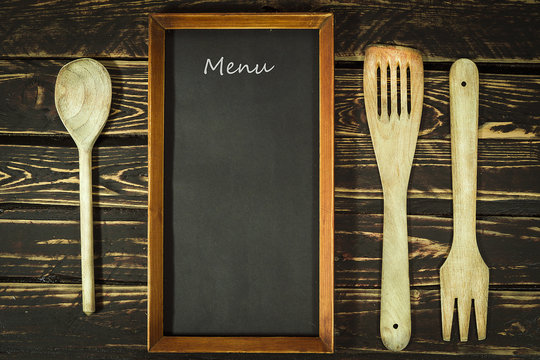 Wooden kitchen accessories and menu blackboard