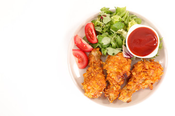 fried chicken with salad and tomato