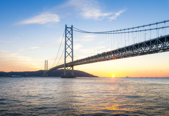 Fototapeta na wymiar Sunrise at the Akashi Kaikyo Ohashi Bridge ,Kobe, Japan