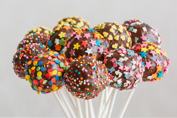 Delicious holiday colored cake pops in a glass