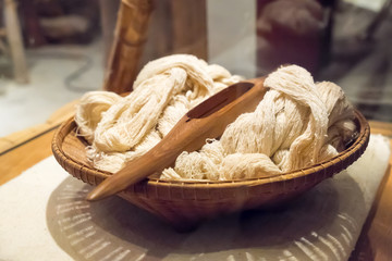 Cotton and shuttle in basket
