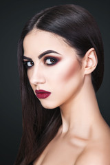 Obraz premium The girl, a woman, a beautiful young girl with professional make