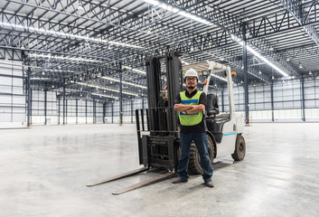 Fototapeta na wymiar Engineer working and standing in warehouse