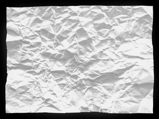 Crumbled paper sheet on black background composition texture