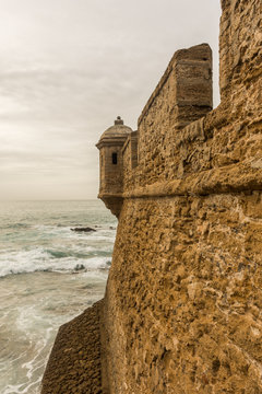 castle on the sea front in the city of cadiz
