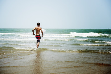 Fototapeta na wymiar Man Beach Summer Holiday Vacation Surfing Concept