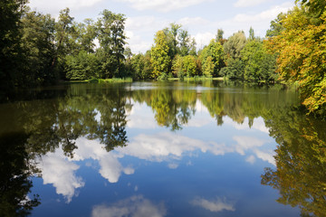 Fototapeta na wymiar A scenic pond in the Arkadia park in Poland