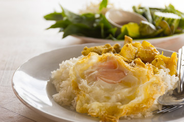 Rice with curry thai style and vegetable with chili paste on table.Street foods of thai,Close up