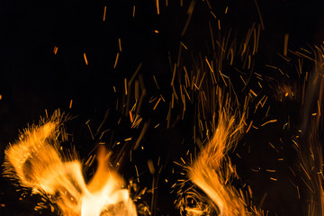 Fire flames on a black background. Blaze fire flame texture back