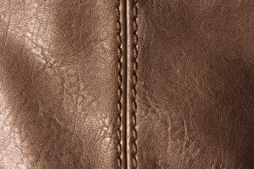 seams on leather hand bag