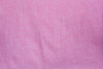 pink crumpled fabric texture, cloth background 