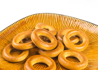 brown plate with small bagels