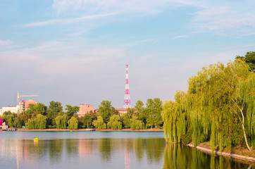 Obraz premium Beautiful House Standing near the Lake in the Countryside, Evening time.
