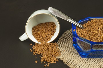 Instant coffee in a glass dish. Preparation of soluble coffee. Decorate store coffee.
