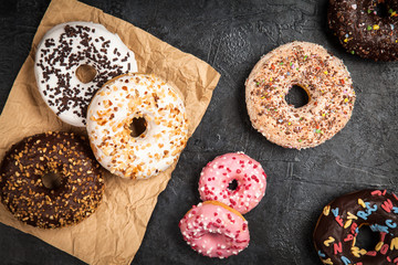 Tasty donuts on dark background