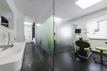 Modern dentistry office interior with chair and tools