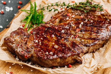 Beef rump steak from marble beef medium rare with sauce on wood