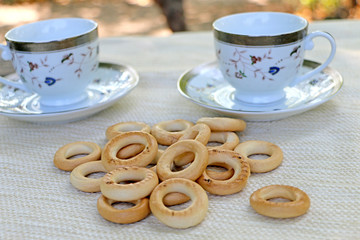 in nature, on the table bagels and cups, 