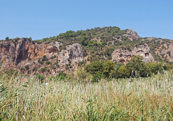 Tombs of the ancient Lycia rulers in rocks on the riverside Dalyan in Turkey