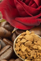 Coffee beans and instant coffee. Granules of instant coffee background. Instant coffee in a glass dish. Preparation of soluble coffee. Decorate store coffee.
