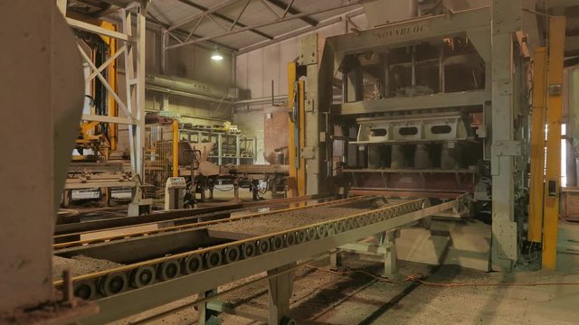 Factory for the production of concrete blocks and paving stones