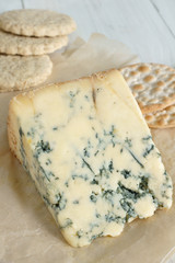 Mature English Stilton cheese with assorted crackers and biscuits
