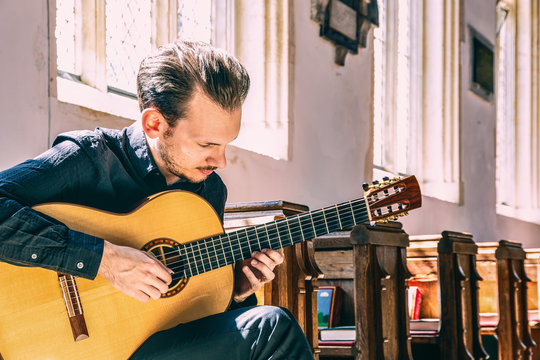 Young male classical guitarist
