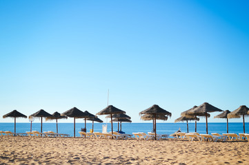 Beach ready for tourists. Golden sand with blue sky outdoors nature background