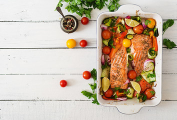 Baked salmon fillet with vegetables. Top view