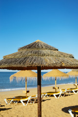 Beach ready for tourists. Golden sand with blue sky outdoors nature background