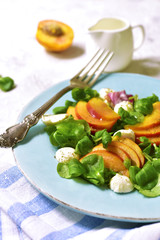 Fresh peach salad with corn and mozzarella.