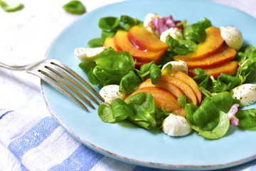 Fresh peach salad with corn and mozzarella.