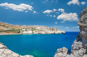 Agios Pavlos Beach in Crete island, Greece. Tourists relax and bath in crystal clear water of St. Paul Sandhill Beach.