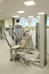 Fototapeta premium Interior of a fitness hall with sport equipment