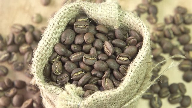 Coffee beans rotating in burlap, close up