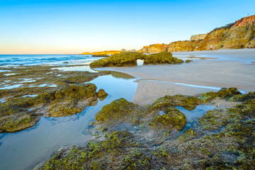 Early morning on the beach of Praia da Rocha, Portimao Coast. Algarve region. Portugal