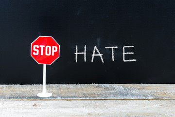 STOP HATE message written on chalkboard