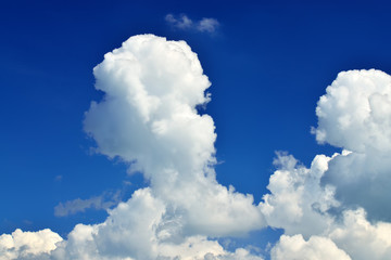 Naklejka na ściany i meble Cumulus clouds on blue sky closeup