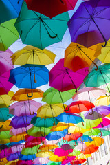 Fototapeta na wymiar Lots of umbrellas coloring the sky in the city of Agueda, Portugal
