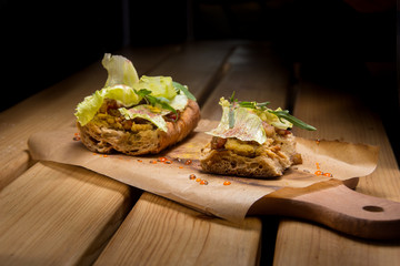 fast food on wooden table with contrast light