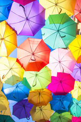 Fototapeta na wymiar Lots of umbrellas coloring the sky in the city of Agueda, Portugal