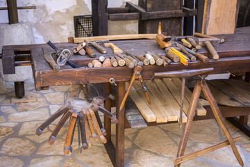 Vintage woodworking tools on a wooden workbench